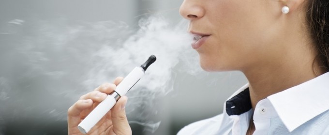 woman smoking an electronic cigarette