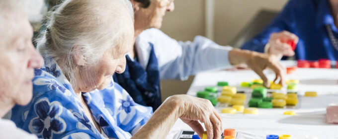 Older people playing bingo