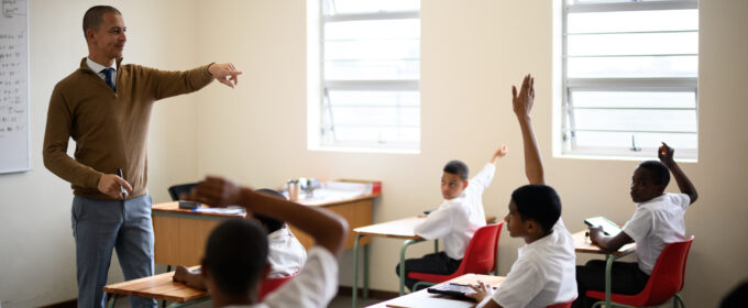 Article image - teacher pointing at schoolchildren