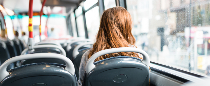 Woman inside a bus travelling alone