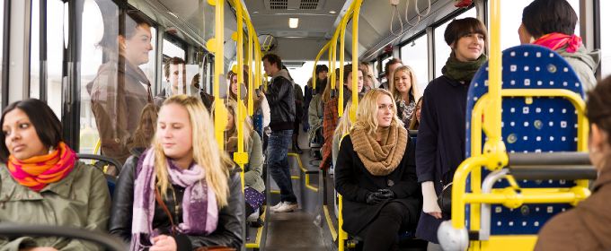 Image of a range of people sitting on a bus